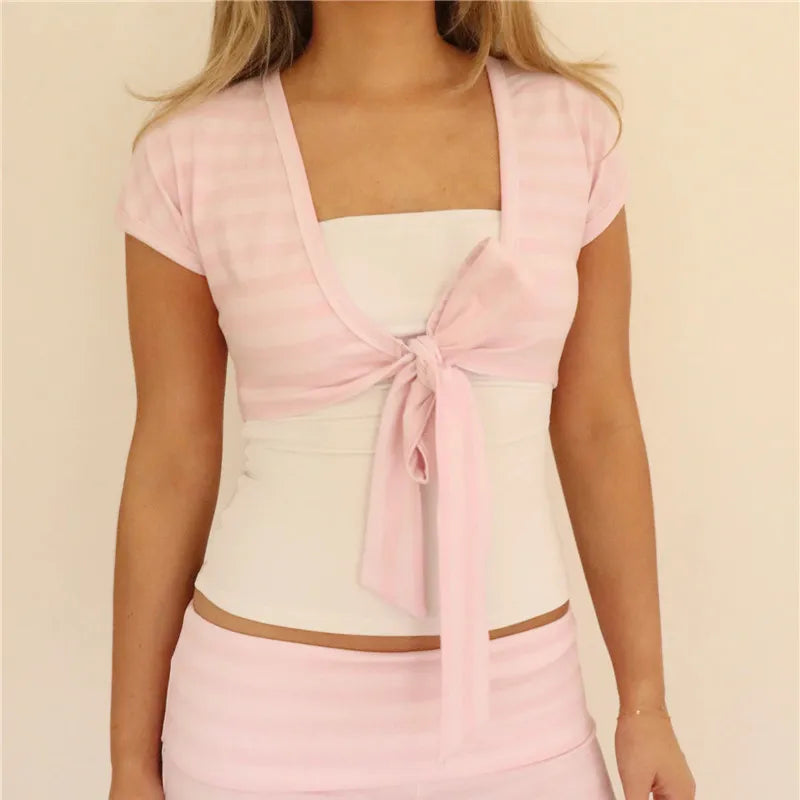 Women's pink cropped cardigan with a tie front, perfect for layering