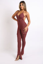Stylish cargo pocket halter jumpsuit in burgundy with a flattering fit and zip front for a trendy look