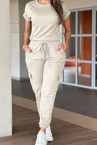 Light beige casual crew neck short sleeve jumpsuit with relaxed fit and pockets for everyday wear