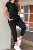 Casual crew neck short sleeve jumpsuit in black with drawstring waist and pockets, perfect for everyday wear