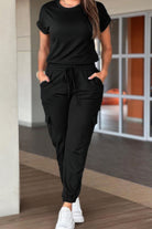 Black casual crew neck short sleeve jumpsuit with elastic waist and pockets for a comfortable fit