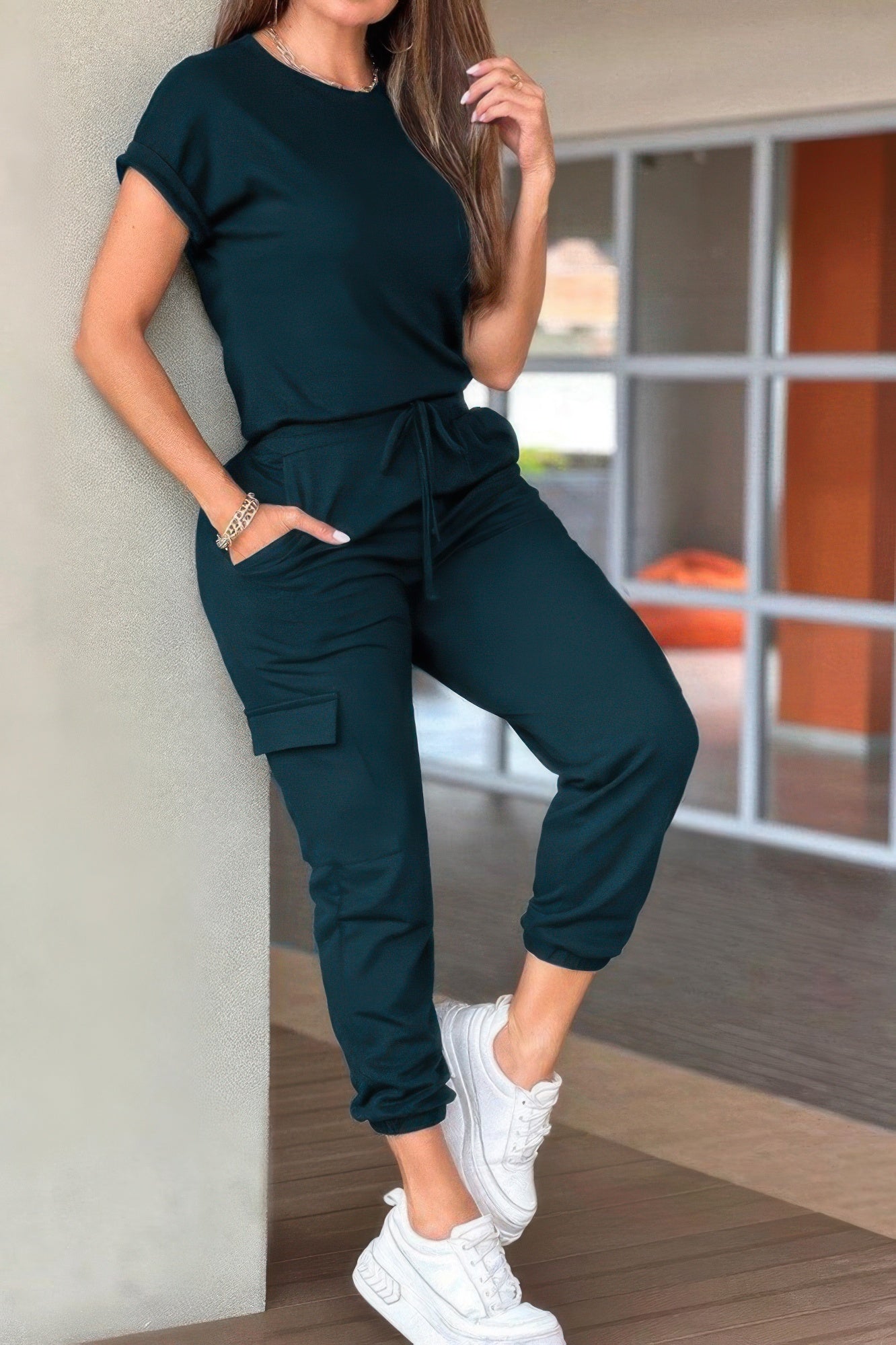 Casual crew neck short sleeve jumpsuit in dark green with drawstring waist and stylish cargo pockets