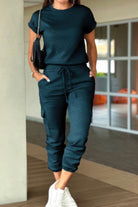 Women's casual crew neck short sleeve jumpsuit in teal with drawstring waist and pockets