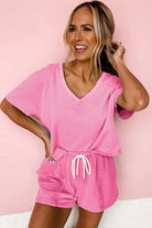 YNIQUE casual drawstring shorts set in pink with V-neck top and adjustable waist tie