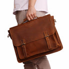Brown casual leather briefcase with dual buckles and a top handle for professional use