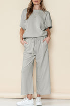 Light gray casual matching sets for travel with short sleeves and wide-leg pants paired with white sneakers
