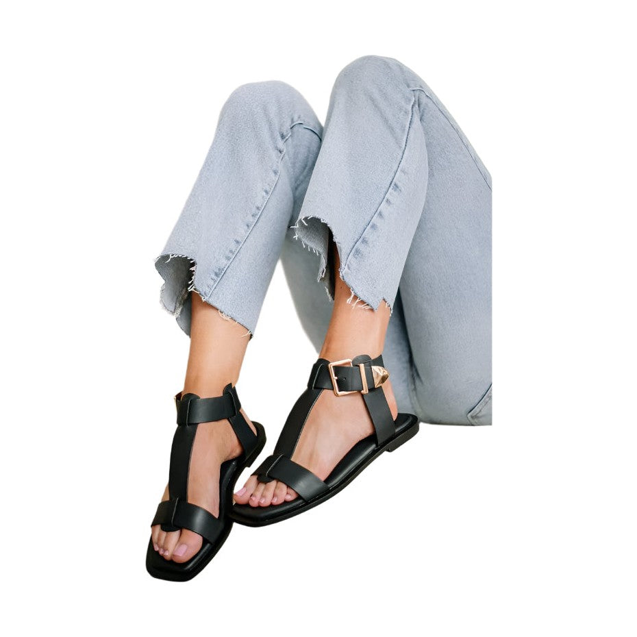 Maker's Shoes women's casual sandals with buckle strap in black worn with light blue jeans