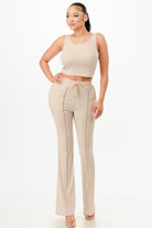 Beige casual two piece outfit for summer with sleeveless crop top and high-waisted pants