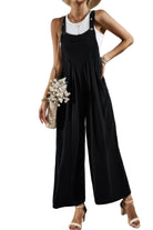 Black casual vacation jumpsuit for women with wide legs and adjustable straps, perfect for sunny getaways