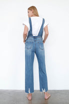 Back view of Insane Gene women's casual vacation overalls in light blue denim with a relaxed fit