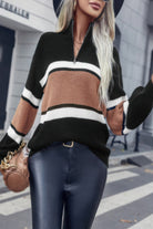 Stylish women's casual vacation pullover sweater in black with striped accents and a half-zip collar