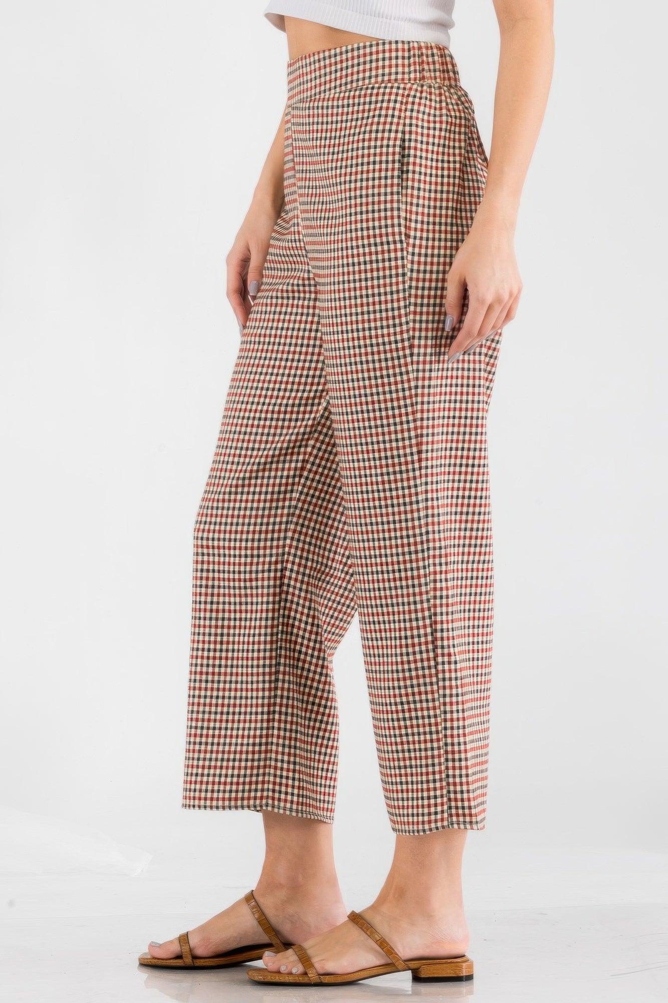 Women wearing casual vacation trousers for women in checkered pattern with side pockets