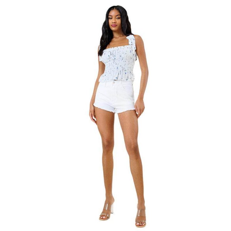 Vibrant M.i.U casual white denim shorts styled with a trendy top for a fresh summer look