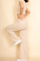 Capella beige casual wide-leg pants outfit paired with white sneakers and a fitted short sleeve top
