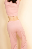 Capella light pink casual wide-leg pants outfit with matching crop top on model