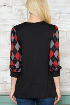 Back view of a stylish checker pattern women's top with black body and plaid sleeves