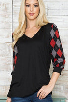 Stylish checker pattern women's top with black body and red plaid sleeves for a trendy casual look