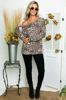 Stylish e Luna Cheetah Print One Shoulder Top paired with black jeans and ankle boots