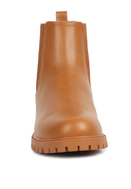 Stylish tan leather Chelsea ankle boots for men with a durable rubber sole and sleek design