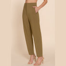 Chic high waisted dress pants for women in olive green styled with nude heels