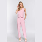 Chic high waisted dress pants for women in light pink paired with matching sleeveless vest by VacationGrabs