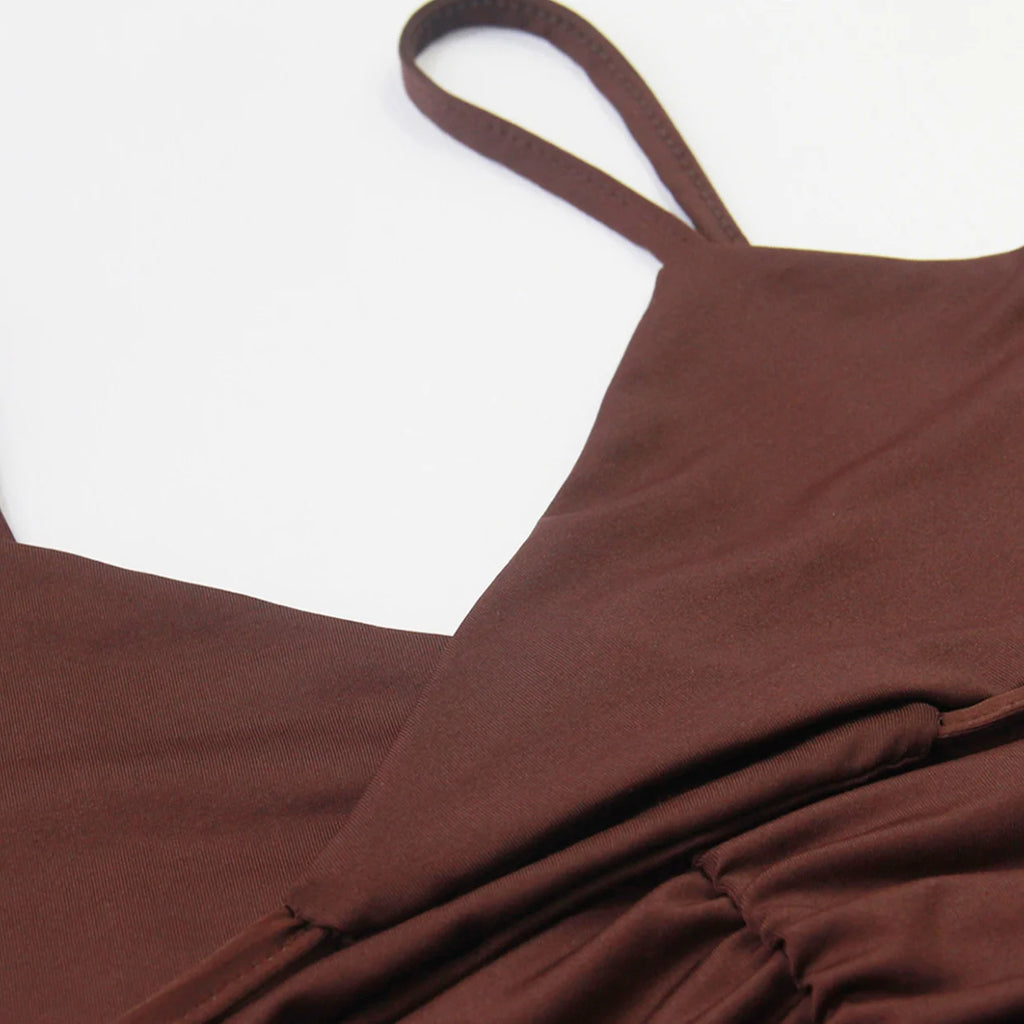 Close-up of brown fabric and strap detail on a sexy spaghetti strap mini dress