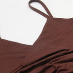 Close-up of brown fabric and strap detail on a sexy spaghetti strap mini dress