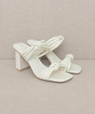 Oasis Society chic vacation heels in cream with stylish knotted straps and a block heel design
