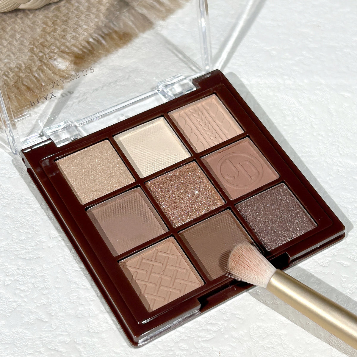9-shade chocolate brown eyeshadow palette with matte and pearl finishes (photo 1 of 6)