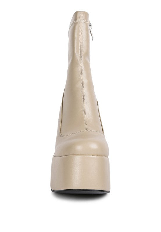 Cream-colored chunky heel fashion boots by Rag Company with a sleek design and zipper closure