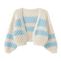 Chunky knit blankets in cream and blue for cozy home decor