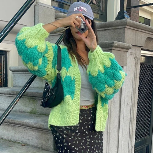 Green and yellow chunky knit blanket, cozy for outdoor lounging