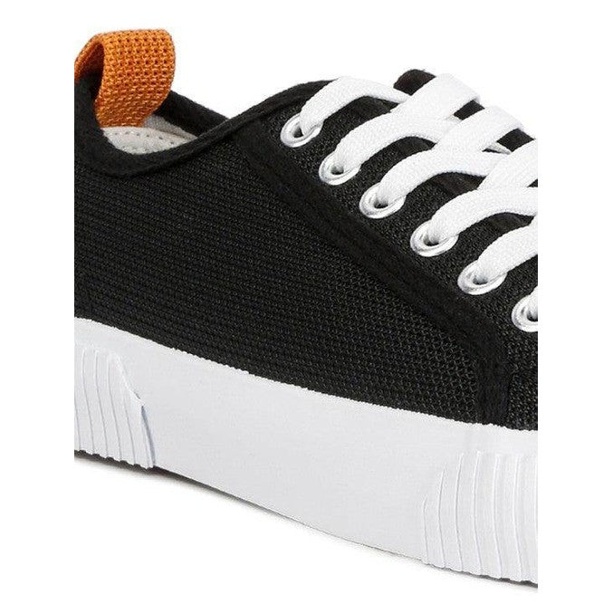 Women's chunky lifestyle sneakers in black with orange accents