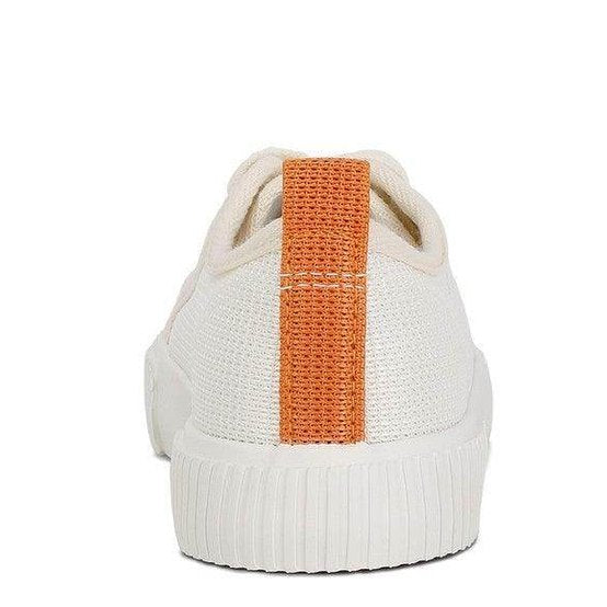 Women's chunky lifestyle sneakers in cream with orange detailing for casual wear