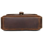 Bottom view of a classic shoulder bag for men in rich brown leather with durable stitching