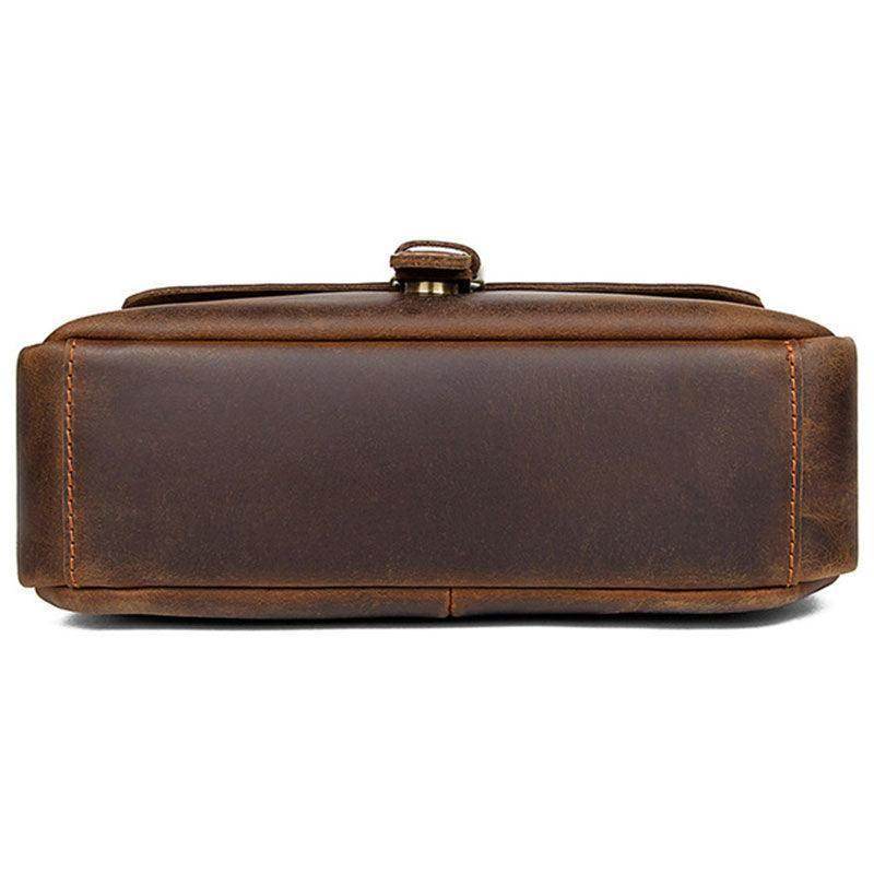 Bottom view of a classic shoulder bag for men in rich brown leather with durable stitching