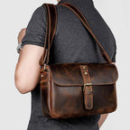 Stylish brown leather classic shoulder bag for men with adjustable strap and buckle closure