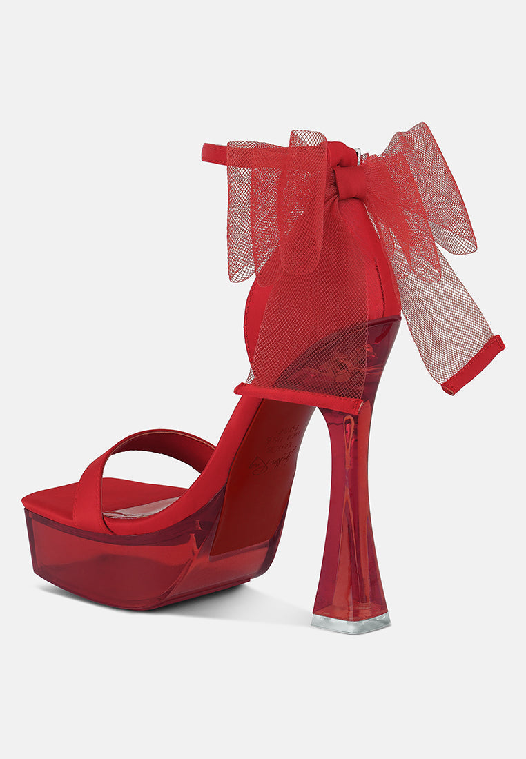 Bold red clear high heeled sandals with a mesh bow detail for stylish women