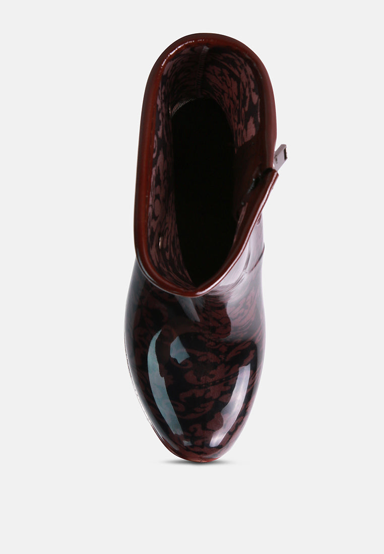 Top view of London Rag International clear wedge rain boots with floral design and glossy finish