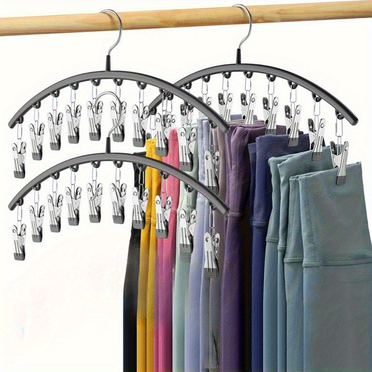Black closet organizer with clips for hanging pants and skirts