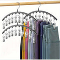 Black closet organizer with multiple clips for hanging clothes