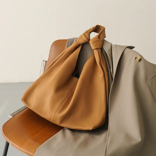 Brown leather coach purse shoulder bag for casual outings