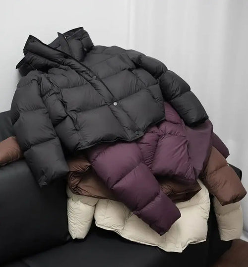 women's coat puffer in black, stylish winter outerwear for warmth