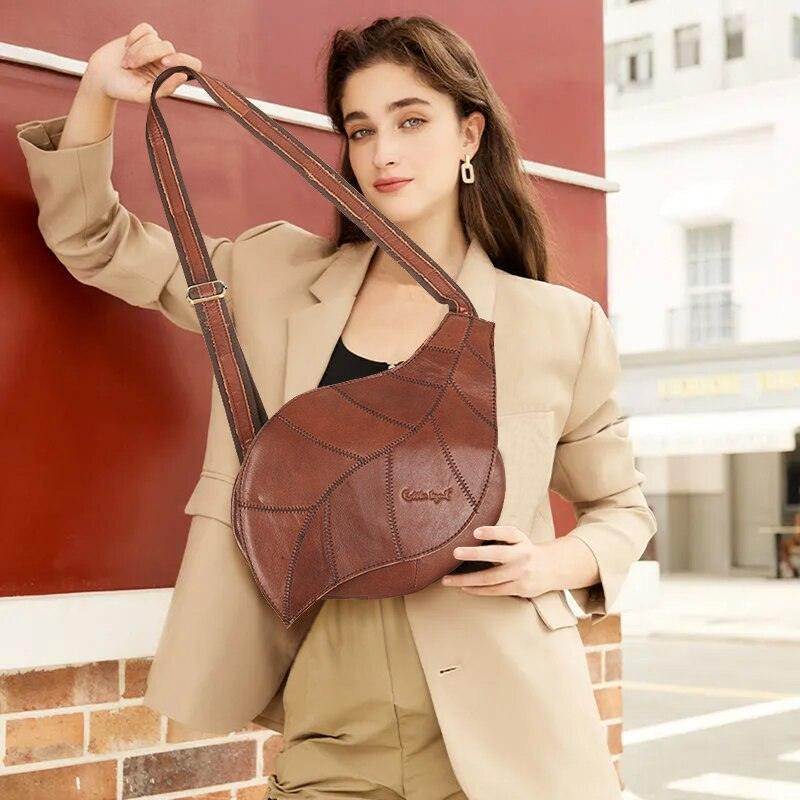 Stylish small leather satchel for vacations with a unique design, perfect for travel or daily use