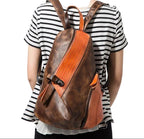 Stylish color block daypack in brown and orange with zippered pockets for everyday use