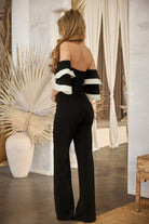 Back view of a women's color block formal jumpsuit with wide sleeves for elegant occasions
