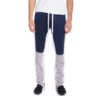 Color block track pants men in navy and grey with adjustable drawstring and tapered fit