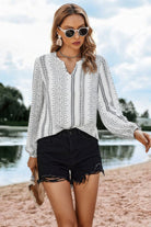 VacationGrabs Women's color block v neck ruffle blouse styled with black shorts by the beach