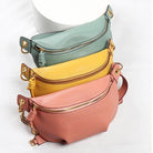 Colorful leather fanny packs in teal, yellow, and pink for stylish and convenient storage