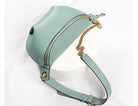 Stylish mint green leather fanny pack from VacationGrabs with gold chain strap and zipper closure